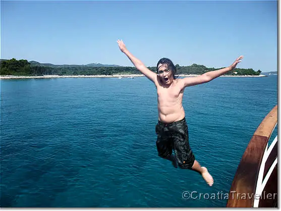 Child jumping from boat